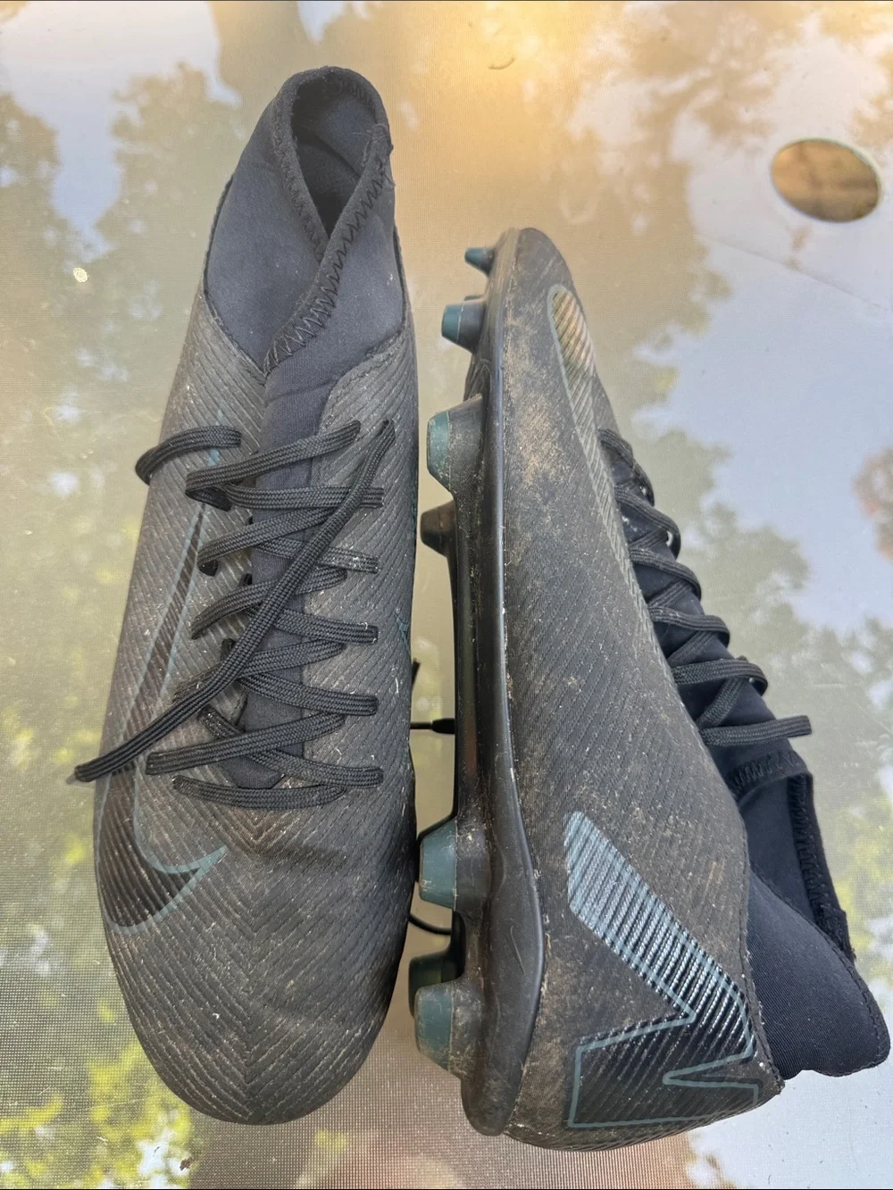 Nike Men’s Black Soccer Cleats with Subtle Blue Swoosh